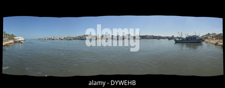 The mouth of the Nile at Damietta, Egypt where the fresh waters of the worlds longest river the Nile meets the end of the road Stock Photo