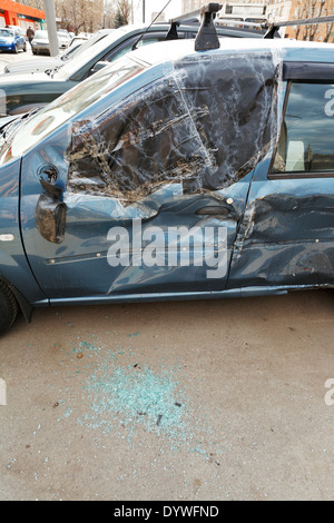 broken window of vehicle during road accident on urban street Stock Photo