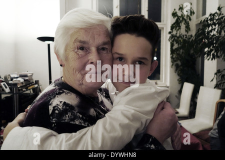 Berlin, Germany, Grandma and grandson hugging each other Stock Photo