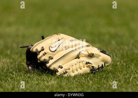 Milwaukee, Wisconsin, USA. 25th Apr, 2014. April 25, 2014: A glove lies on the grass just prior to the start of the Major League Baseball game between the Milwaukee Brewers and the Chicago Cubs at Miller Park in Milwaukee, WI. John Fisher/CSM/Alamy Live News Stock Photo