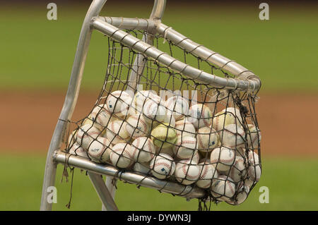Milwaukee, Wisconsin, USA. 25th Apr, 2014. April 25, 2014: Major League baseballs sit in a basket during batting practice just prior to the start of the Major League Baseball game between the Milwaukee Brewers and the Chicago Cubs at Miller Park in Milwaukee, WI. John Fisher/CSM/Alamy Live News Stock Photo