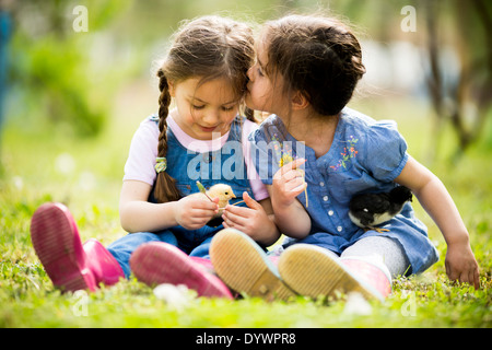 Two little girls with chickens Stock Photo