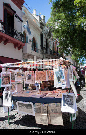 Woman selling old newspapers and photos. San Telmo flea market. Buenos Aires. Argentina Stock Photo