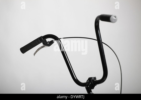 Detail on a retro handlebar of a bicycle with one brake. Stock Photo