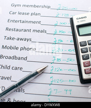 Adding up monthly household and personal expenses, London Stock Photo