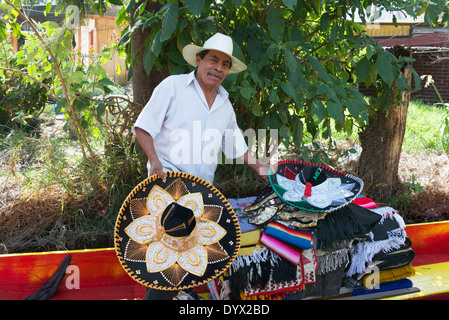 Mexican hat selling to tourists from boat Xochmilco Mexico City Mexico Stock Photo