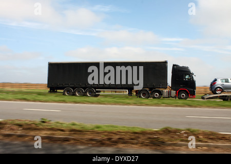 An unmarked truck traveling along the A417 dual carriageway in the Cotswolds, England Stock Photo