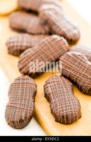 Gourmet Chocolate covered Nutter Butters with chocolate design on top. Stock Photo