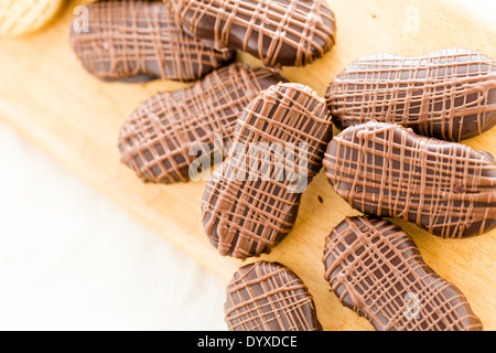 Gourmet Chocolate covered Nutter Butters with chocolate design on top. Stock Photo