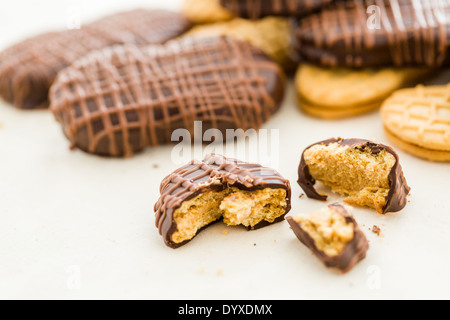 Gourmet Chocolate covered Nutter Butters with chocolate design on top. Stock Photo