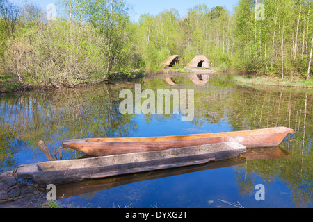 Dougout canoes on a lake Stock Photo
