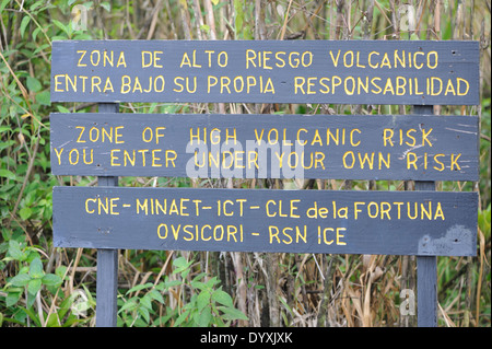 Sign warning that you are entering a zone of high volcanic risk, you enter at your own risk. Arenal Volcano National Stock Photo