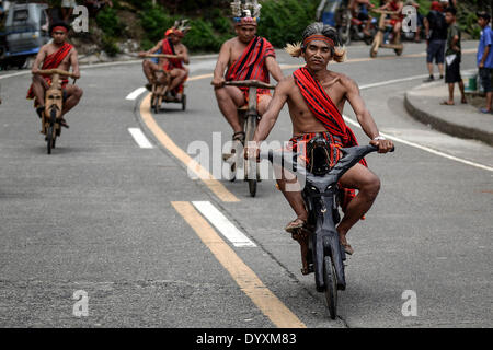 Banaue, Philippines. 27th Apr, 2014. Ifugao tribesmen ride wooden scooters during the Imbayah festival in Banaue town, Ifugao province, northern Philippines, April 27, 2014. The Imbayah festival is a celebration of Ifugao culture and thanksgiving, a gathering of the many tribes that make up the population of the Ifugao Rice Terraces, a UNESCO World Heritage site.Photo: Ezra Acayan/NurPhoto Credit:  Ezra Acayan/NurPhoto/ZUMAPRESS.com/Alamy Live News Stock Photo