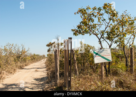 Mato Grosso State, Brazil. Entrance to the Indigenous Park of the Xingu with FUNAI sign 'Protected Land, no access for strangers'. Stock Photo