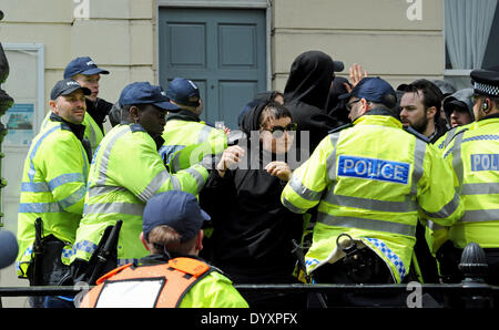 Brighton, UK. 27th Apr, 2014. Police clash with anti fascist protesters at the March for England Rally in Brighton today.About 100 people took part in the rally which caused major disruption in the city with a massive police presence trying to keep anti fascist protesters away from the marchers Stock Photo