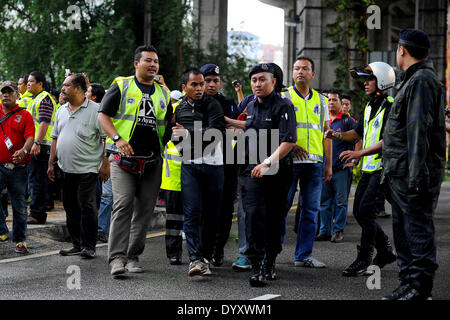 Kuala Lumpur, Malaysia. 27th Apr, 2014. A demonstrator is nabbed by the Malaysian Police during a protest outside University of Malaya during U.S. President Barack Obama's Malaysia visit in Kuala Lumpur, Malaysia, Sunday, April 27, 2014. With the first visit to Malaysia by a U.S. president in nearly half a century, Obama holds economic and security talks with Malaysian Prime Minister Najib Razak, who leads a southeast Asian nation with an important role in Obama's efforts to forge deeper ties with the region. © Joshua Paul/NurPhoto/ZUMAPRESS.com/Alamy Live News Stock Photo