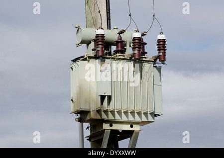 Old oil coled high voltage transformer Stock Photo