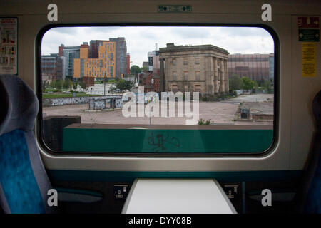 Birmingham, UK. 27th Apr, 2014. The old Curzon Street Station in Birmingham and the derelict area around it is the site of a proposed new station if the controversial HS2 rail link is constructed. This image was taken from a train traveling into Birmingham New Street station on the existing West Coast Mainline. The new buildings in the background all form part of the new East Side Credit:  Richard Franklin/Alamy Live News Stock Photo
