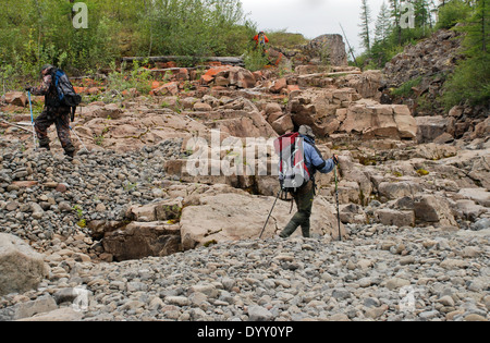 The journey on foot on the mountain side of the Putorana plateau. Stock Photo