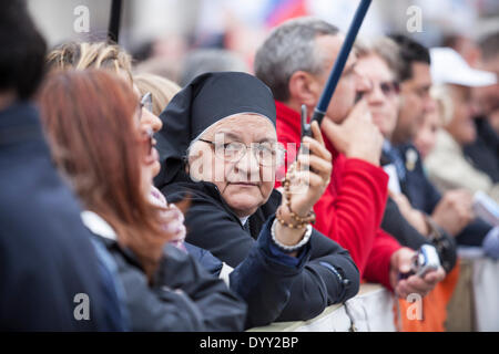 Vatican City. 27th April, 2014. Canonisation of Pope John Paul II and Pope John XXIII A nun in amongst the crowd waits for the service to begin. Credit:  Stephen Bisgrove/Alamy Live News Stock Photo