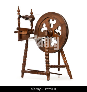 Wooden handmade spinning wheel against white background Stock Photo