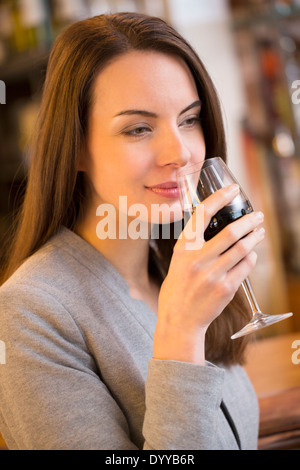 Young beautiful woman eating bar. Beautiful little girl eating coconut ...