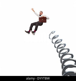 flying businessman and huge metal spring on white background Stock Photo