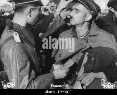A German officer with a Polish prisoner Stock Photo