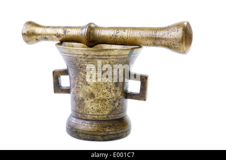 Brass mortar with a pestle isolated on a white background Stock Photo