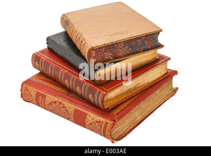Four very old antiquarian books stacked on side in leather covers. Stock Photo