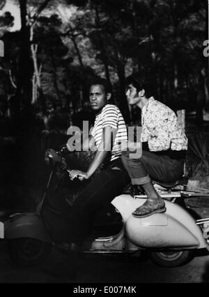 Young men with a Vespa in Paris, 1960 Stock Photo