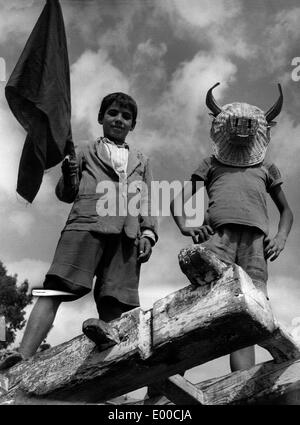 Children play bullfighting in an andalusian village Stock Photo