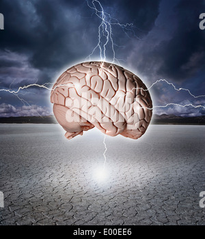 Brain being shocked with lightning over a dry lake bed. Stock Photo