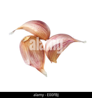 Three garlic cloves isolated on white background Stock Photo
