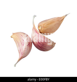 Three garlic cloves isolated on white background Stock Photo