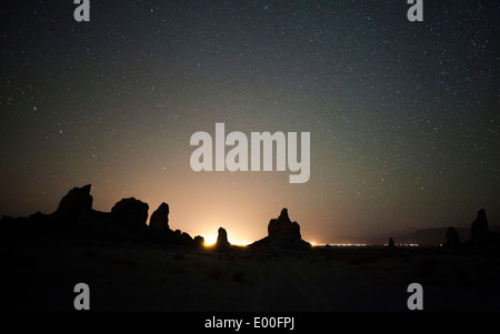 Large tufa formations at Trona Pinnacles against a backdrop of stars. Stock Photo