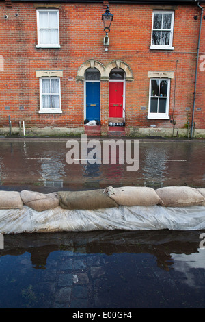 Flooded street in Winchester, Hampshire, England, UK. Flooding is becoming more frequent with climate change. Stock Photo