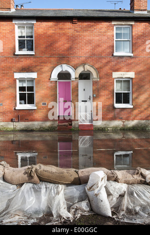 Flooded street in Winchester, Hampshire, England, UK. Flooding is becoming more frequent with climate change. Stock Photo