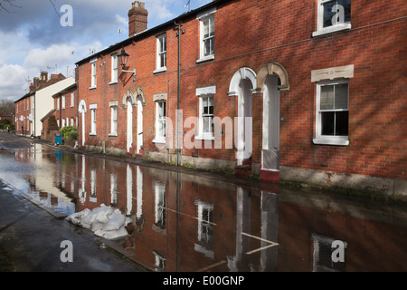 Flooded street in Winchester, Hampshire, England, UK. Flooding is becoming more frequent with climate change. Stock Photo