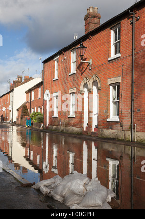 Flooded street in Winchester, Hampshire, England, UK. Flooding is becoming more frequent with climate change. Stock Photo