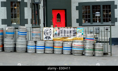 Beer barrels stacked on the street outside the Fishpond public house Matlock Bath Derbyshire England UK Stock Photo