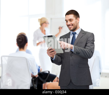 smiling buisnessman with tablet pc computer Stock Photo