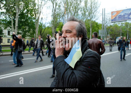 Donetsk, Ukraine. 28th Apr, 2014. A large part of the Ukranian population of Donetsk has gathered today to rally in favor of an european Ukraine and against the russian occupation.  The parade started in front all'Olimpisky Stadium, a few minutes after starting the procession, joyous and colorful, was attacked by pro-Russian activists with stones and bombs, the police made sure to calm everyone down, but if the pro-maidan parade had to dissolve, the pro-Russian continued hitting even ordinary civilians. in photo: a protester  Cosimo Attanasio/Alamy Live News Stock Photo