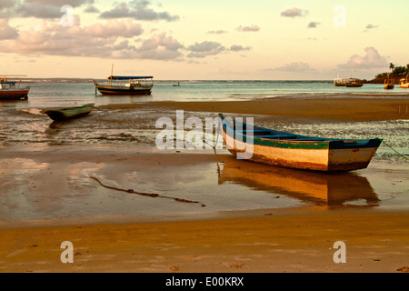 Fishing boats resting on the sand. Itacare, Bahia, Brazil Stock Photo