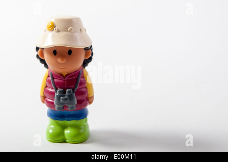 The Fisher Price Little People brand of toys featuring the little boy with the binoculars on a camping expedition. Stock Photo