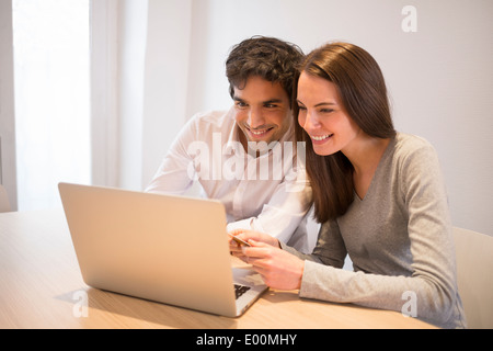 Woman man computer shopping online home Stock Photo