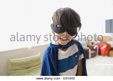 Portrait of boy wearing cape and mask