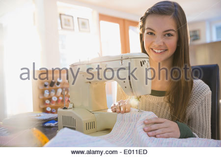 Portrait of girl using sewing machine