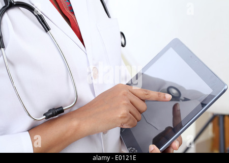Closeup view of doctor using tablet computer Stock Photo