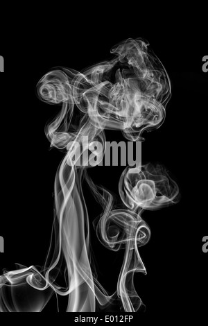 white smoke isolated on a black background Stock Photo